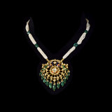 Graceful peacock pendant set adorned with diamond polki, delicately strung with pearls and emerald maniya, celebrating timeless heritage and refined elegance.(KMPE1364)