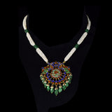 Graceful peacock pendant set adorned with diamond polki, delicately strung with pearls and emerald maniya, celebrating timeless heritage and refined elegance.(KMPE1364)