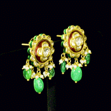 Graceful peacock pendant set adorned with diamond polki, delicately strung with pearls and emerald maniya, celebrating timeless heritage and refined elegance.(KMPE1364)