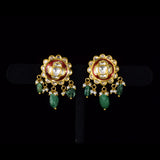 Graceful peacock pendant set adorned with diamond polki, delicately strung with pearls and emerald maniya, celebrating timeless heritage and refined elegance.(KMPE1364)