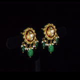 Graceful peacock pendant set adorned with diamond polki, delicately strung with pearls and emerald maniya, celebrating timeless heritage and refined elegance.(KMPE1364)