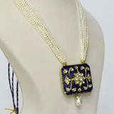 A stunning blue meena pendant adorned with sparkling diamond polki, beautifully strung with lustrous pearls. This traditional design blends vibrant enamel artistry with timeless elegance, perfect for festive occasions.(KMPE1365)