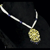 Blue Meenakari Pendant Set Elegant blue meenakari pendant set adorned with diamond polki, gracefully strung with pearls and sapphire maniya, celebrating timeless heritage and sophistication.(KMPE1372)