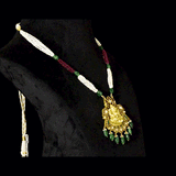 Divine Temple Pendant Exquisite temple-style pendant featuring Goddess Lakshmi, sparkling diamond polki, vibrant coloured gemstones, and emerald drops, celebrating timeless heritage and divine elegance.(KMPE1373)