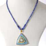 A stunning fusion-style pendant and earring set featuring Firoza Meena, Diamond Polki, and brilliant diamonds, elegantly paired with sapphire bead strands for a vibrant, luxurious, and timeless statement look.(KMPE1381)