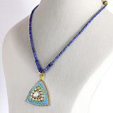 A stunning fusion-style pendant and earring set featuring Firoza Meena, Diamond Polki, and brilliant diamonds, elegantly paired with sapphire bead strands for a vibrant, luxurious, and timeless statement look.(KMPE1381)