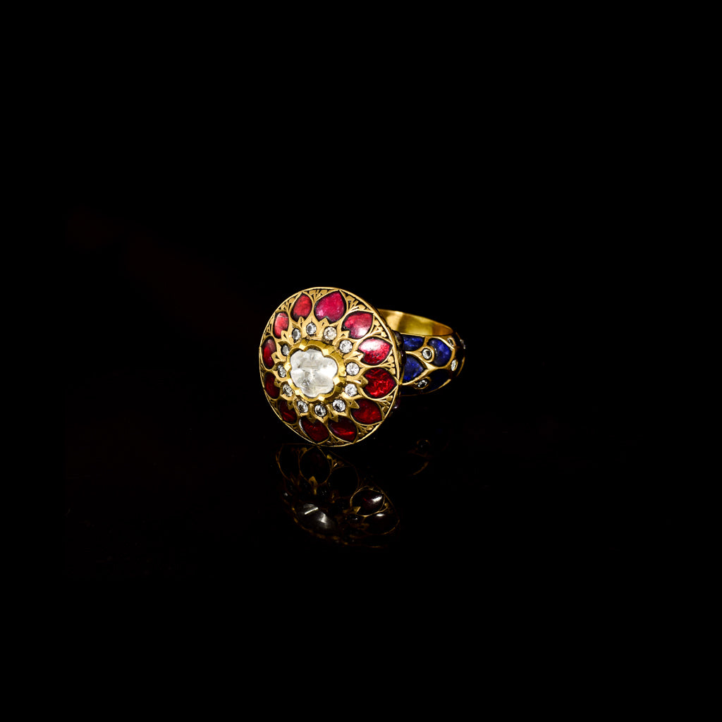 Celebrate timeless beauty with this traditional Jadau ring, adorned with vibrant color stones and sparkling diamond Polki. A masterpiece of heritage craftsmanship, perfect for adding regal elegance to any occasion.(KMR0168)