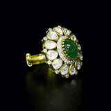Emerald Halo Ring A vivid emerald takes center stage, encircled by radiant diamond polki and brilliant diamonds, creating a timeless statement of refined luxury.(KMR0180)