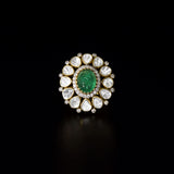 Emerald Halo Ring A vivid emerald takes center stage, encircled by radiant diamond polki and brilliant diamonds, creating a timeless statement of refined luxury.(KMR0180)