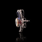 An heirloom-worthy floral brooch crafted with luminous Diamond Polki, vivid emerald, ruby, sapphire, and brilliant diamonds.(NP391)