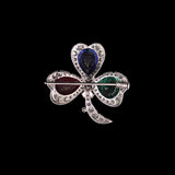 An heirloom-worthy floral brooch crafted with luminous Diamond Polki, vivid emerald, ruby, sapphire, and brilliant diamonds.(NP391)
