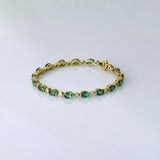 Graceful and elegant, this bracelet features vibrant emeralds paired with sparkling diamonds, creating a timeless design that adds beauty, charm, and a touch of luxury to any look.(PGDBR064)
