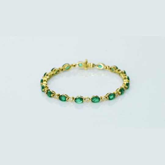 Graceful and elegant, this bracelet features vibrant emeralds paired with sparkling diamonds, creating a timeless design that adds beauty, charm, and a touch of luxury to any look.(PGDBR064)