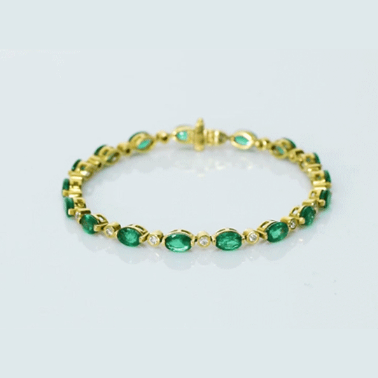 Graceful and elegant, this bracelet features vibrant emeralds paired with sparkling diamonds, creating a timeless design that adds beauty, charm, and a touch of luxury to any look.(PGDBR064)