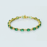 Graceful and elegant, this bracelet features vibrant emeralds paired with sparkling diamonds, creating a timeless design that adds beauty, charm, and a touch of luxury to any look.(PGDBR064)