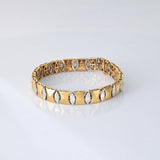 Sleek gold meets shimmering diamonds in a flexible design—crafted for effortless elegance and everyday luxury. (PGDBR073)