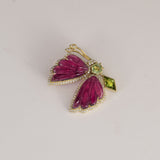 Butterfly Brooch Graceful butterfly brooch featuring carved pink tourmaline wings, vibrant peridot accents, and brilliant diamonds, celebrating nature-inspired elegance with contemporary sophistication.(PGDBRCH001)