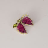 Butterfly Brooch Graceful butterfly brooch featuring carved pink tourmaline wings, vibrant peridot accents, and brilliant diamonds, celebrating nature-inspired elegance with contemporary sophistication.(PGDBRCH001)