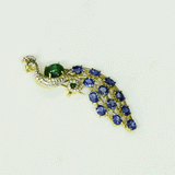 Royal Peacock Brooch Elegant peacock brooch adorned with vivid blue sapphires, rich emerald, and brilliant diamonds, beautifully capturing regal grace and timeless sophistication.(PGDBRCH002)