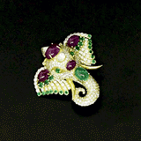 Royal Elephant Brooch Majestic elephant brooch adorned with vibrant rubies, rich emeralds, and brilliant diamonds, blending artistic craftsmanship with timeless elegance and regal charm.(PGDBRCH003)