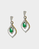 A beautifully crafted pendant and earring set featuring pear-shaped emeralds, diamonds, and mother-of-pearl, blending vibrant colour with delicate design for luxurious elegance. (PGDPE0119)