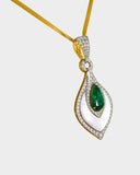A beautifully crafted pendant and earring set featuring pear-shaped emeralds, diamonds, and mother-of-pearl, blending vibrant colour with delicate design for luxurious elegance. (PGDPE0119)