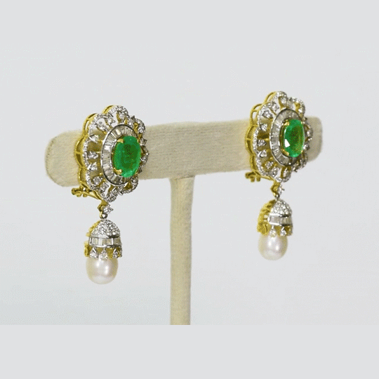 Embrace sophistication and grace with our enchanting earring pair. Featuring mesmerizing emerald-cut ovals adorned with sparkling diamonds, elegantly crowned with South Sea pearl drops accented by diamond caps.(PGDE0381)