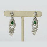 Beautifully crafted long earrings featuring round diamonds, polki diamonds, and emerald mani beads, offering classic style and graceful charm. (PGDE0422)