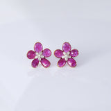 Inspired by blooming flowers, these ruby and diamond tops add a touch of color, sparkle, and sophistication to every look.(PGDE0437)