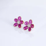 Inspired by blooming flowers, these ruby and diamond tops add a touch of color, sparkle, and sophistication to every look.(PGDE0437)
