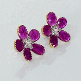 Inspired by blooming flowers, these ruby and diamond tops add a touch of color, sparkle, and sophistication to every look.(PGDE0437)