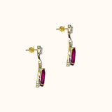 Graceful ruby pear earrings accented with brilliant diamonds, offering a classic yet luxurious style that never goes unnoticed.(PGDE0440)