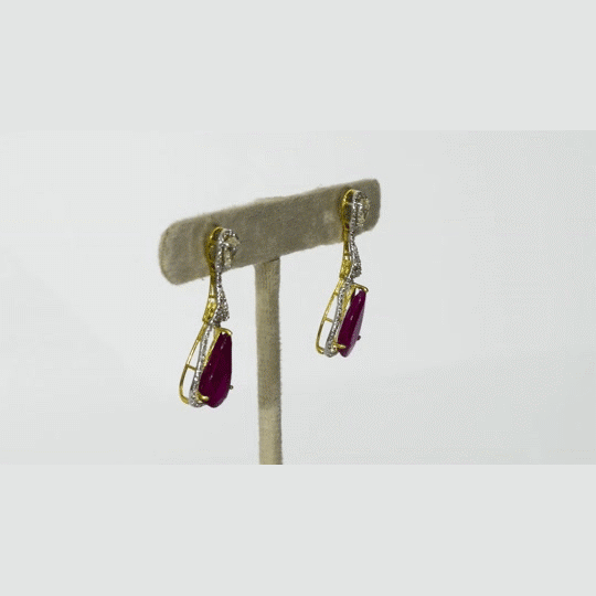 Graceful ruby pear earrings accented with brilliant diamonds, offering a classic yet luxurious style that never goes unnoticed.(PGDE0440)