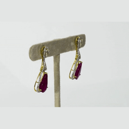 Graceful ruby pear earrings accented with brilliant diamonds, offering a classic yet luxurious style that never goes unnoticed.(PGDE0440)