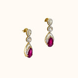 Graceful ruby pear paired with sparkling diamonds create elegant earrings that radiate beauty, brilliance, and timeless sophistication.(PGDE0442)