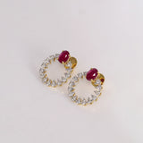 Ruby & Diamond Halo Earrings Brilliant ruby stud earrings embraced by a sparkling halo of round diamonds, blending timeless elegance with contemporary sophistication for every occasion.(PGDE0443)
