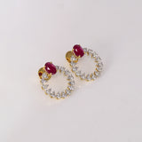 Ruby & Diamond Halo Earrings Brilliant ruby stud earrings embraced by a sparkling halo of round diamonds, blending timeless elegance with contemporary sophistication for every occasion.(PGDE0443)