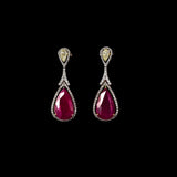 Ruby & Diamond Drop Earrings Graceful drop earrings showcasing vibrant pear-shaped rubies, accented with brilliant round diamonds and elegant pear-cut diamonds for timeless sophistication and brilliance.(PGDE0451)