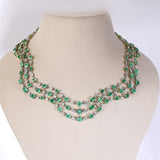 Colombian Emerald Masterpiece Exquisite necklace set featuring exceptional Colombian emeralds, brilliant round and baguette diamonds in an elegant multi-layer design, paired with graceful statement earrings radiating timeless luxury.(PGDNE057)