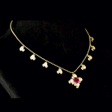 Ruby & Diamond Polki Necklace Graceful gold chain necklace featuring a vibrant ruby centerpiece, accented with diamond polki and brilliant round diamonds for timeless elegance and charm.(PGDNE0154)