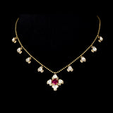 Ruby & Diamond Polki Necklace Graceful gold chain necklace featuring a vibrant ruby centerpiece, accented with diamond polki and brilliant round diamonds for timeless elegance and charm.(PGDNE0154)