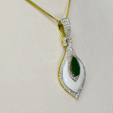 A beautifully crafted pendant and earring set featuring pear-shaped emeralds, diamonds, and mother-of-pearl, blending vibrant colour with delicate design for luxurious elegance. (PGDPE0119)