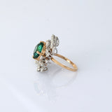 A fine emerald centerpiece surrounded by sparkling diamonds, creating a graceful ring that radiates timeless elegance and brilliance.(PGDR0460)