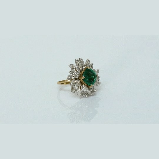 A fine emerald centerpiece surrounded by sparkling diamonds, creating a graceful ring that radiates timeless elegance and brilliance.(PGDR0460)