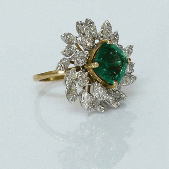 A fine emerald centerpiece surrounded by sparkling diamonds, creating a graceful ring that radiates timeless elegance and brilliance.(PGDR0460)