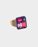 A beautifully crafted ring showcasing tourmaline, pink sapphire, blue sapphire, and diamonds, radiating elegance, vibrant colour, and distinctive style. (PGDR0470)