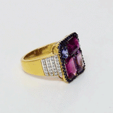 A beautifully crafted ring showcasing tourmaline, pink sapphire, blue sapphire, and diamonds, radiating elegance, vibrant colour, and distinctive style. (PGDR0470)