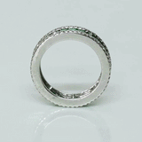 A timeless eternity band showcasing vivid channel-set emeralds, framed by brilliant round diamonds for an elegant statement of everlasting luxury.(PGDR0510)