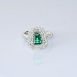 A fine emerald centerpiece surrounded by sparkling diamonds, creating a timeless ring filled with elegance, beauty, and charm.(PGDR0511)