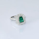 A fine emerald centerpiece surrounded by sparkling diamonds, creating a timeless ring filled with elegance, beauty, and charm.(PGDR0511)